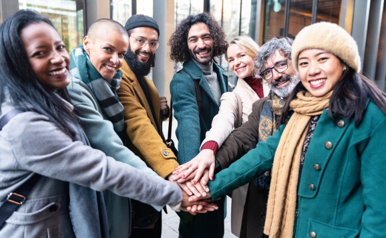 professional coworker people team stacking hands