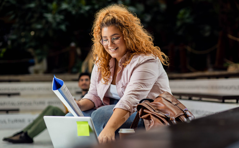 portrait of female student siting in campus using 2023 11 27 05 33 30 utc